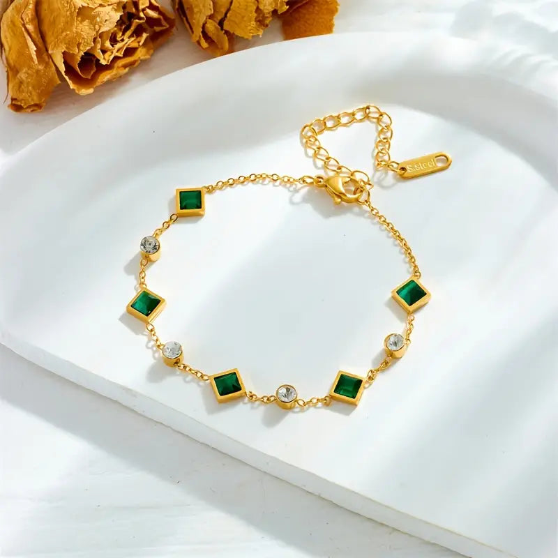 Zlatý řetízkový náramek se smaragdy